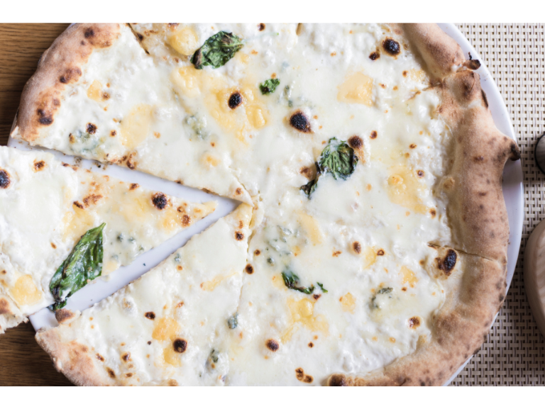 White pizza with stracciatella, lemons, spring onions and anchovies