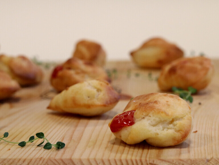 Small madeleine with cherry tomatoes and goat cheese